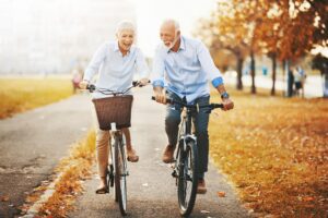 couple cycling together at the park enjoying it